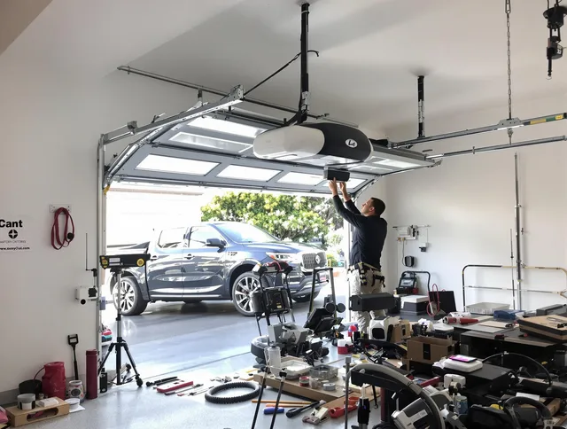 Manchester Garage Door Repair specialist installing smart garage door opener system in Manchester home