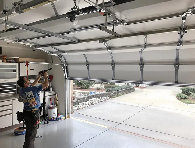 Garage door track repair service by Manchester Garage Door Repair in Manchester